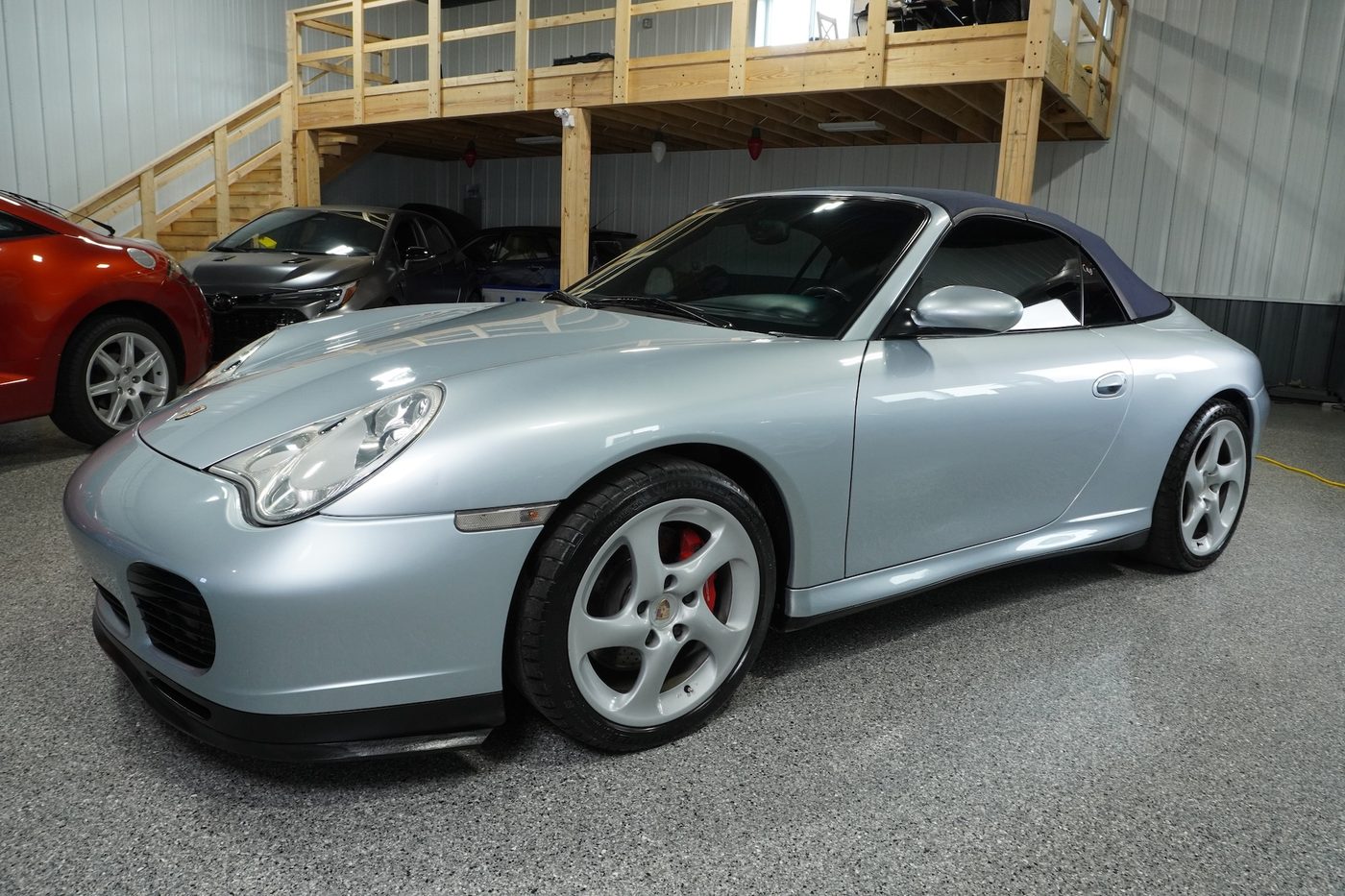 2004 Porsche 911 C4S Cabriolet, silver, in the showroom