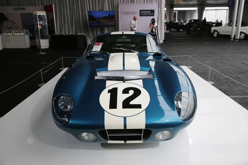 A blue Daytona Coupe on the road