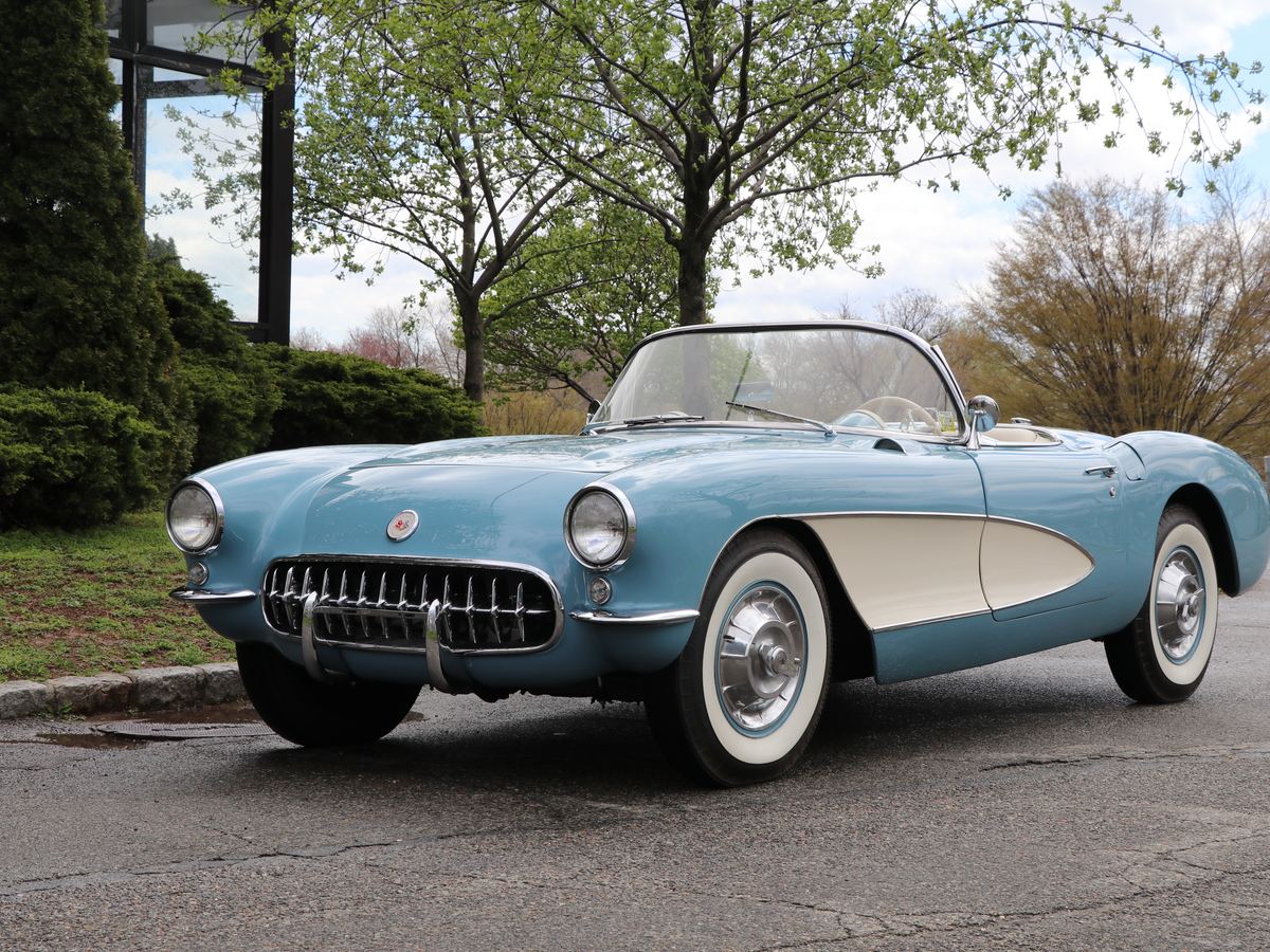 Light blue 1950s convertible with white coves